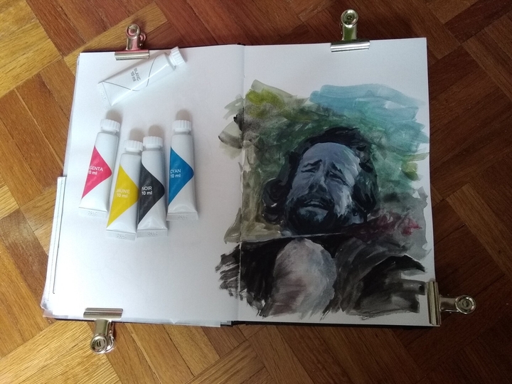 Photo of a sketchbook with tubes of cheap gouache on the left page, and a man having his throat cut on the right, from the latest season of The Witcher.